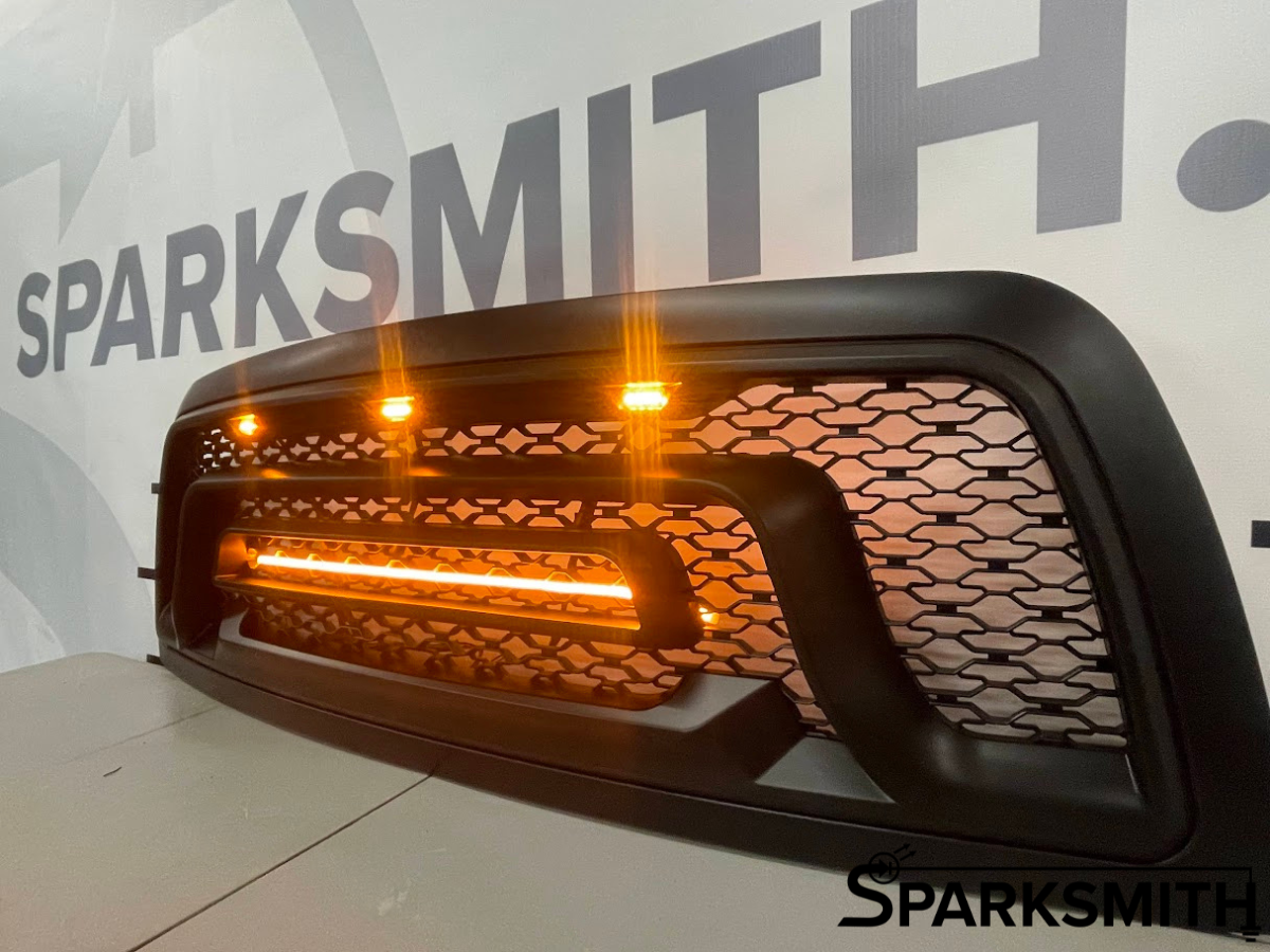 Grille+ 2013-2018 Dodge RAM 1500 Rebel Style Grille w/ Amber LED Lights