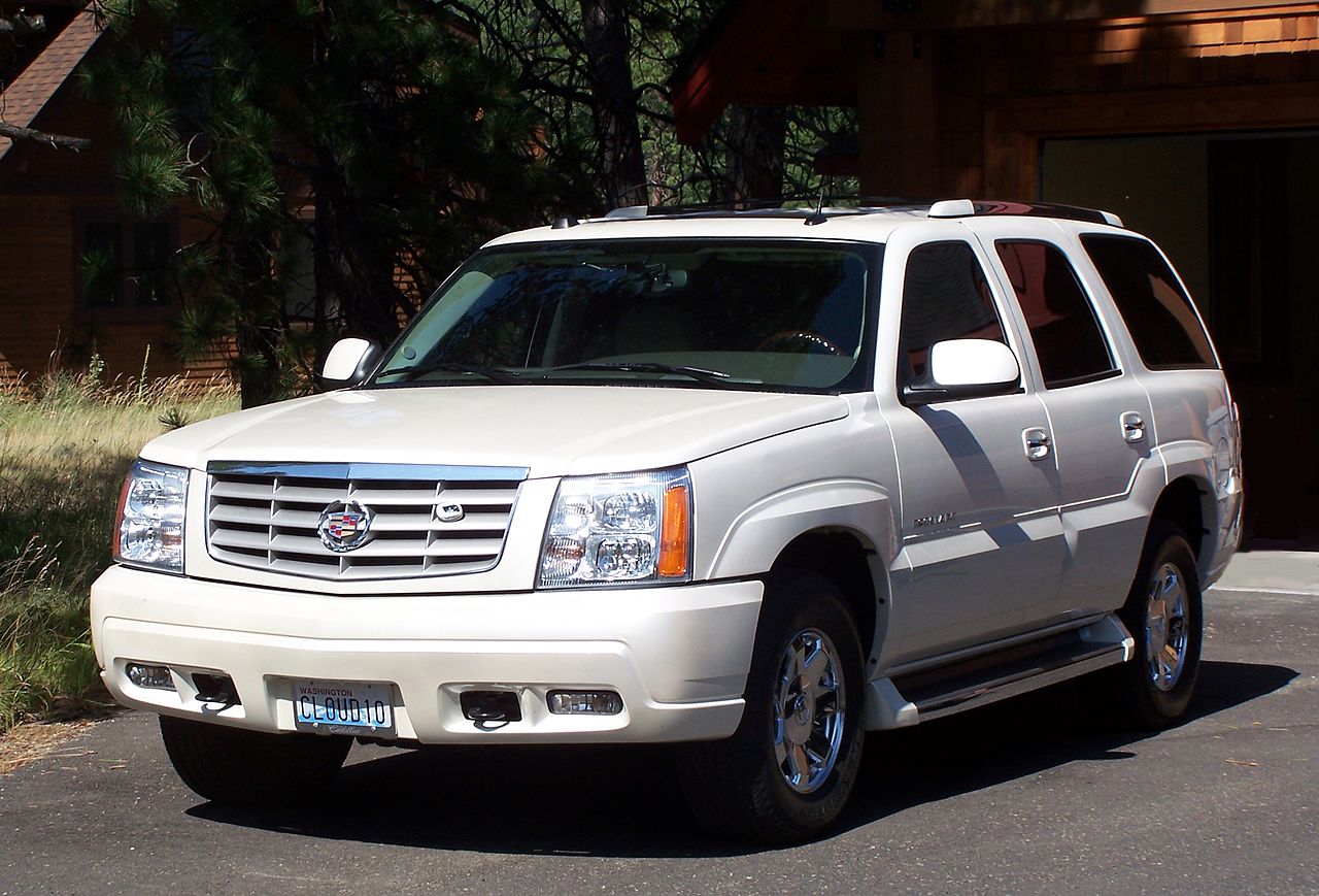 Image Credits: White Cadillac Escalade image is owned by Self Drive Vehicle Hire (https://sdvh.co.uk/). I only put this here because the spineless cowards hired a lawyer telling me I had to.